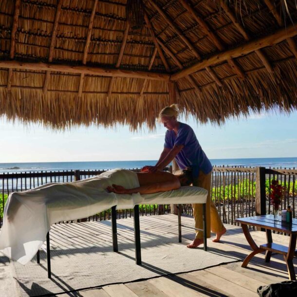 Outdoor massage by the ocean at Alive Beach House