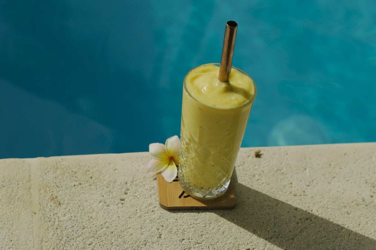 Fresh banana and pineapple smoothie by the pool at Alive Beach House